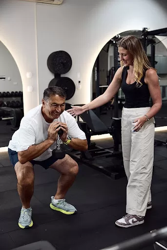 Osteopathy exercise rehabilitation with an experienced osteopath for improved movement Patient completing exercise rehabilitation guided by an osteopath at an osteopathic clinic